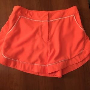 Neon orange shorts with pockets